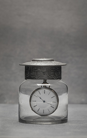 Vintage clock inside glass jar